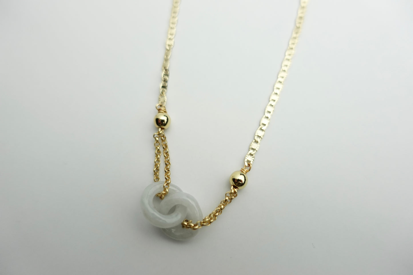 Interlinked white jade necklace