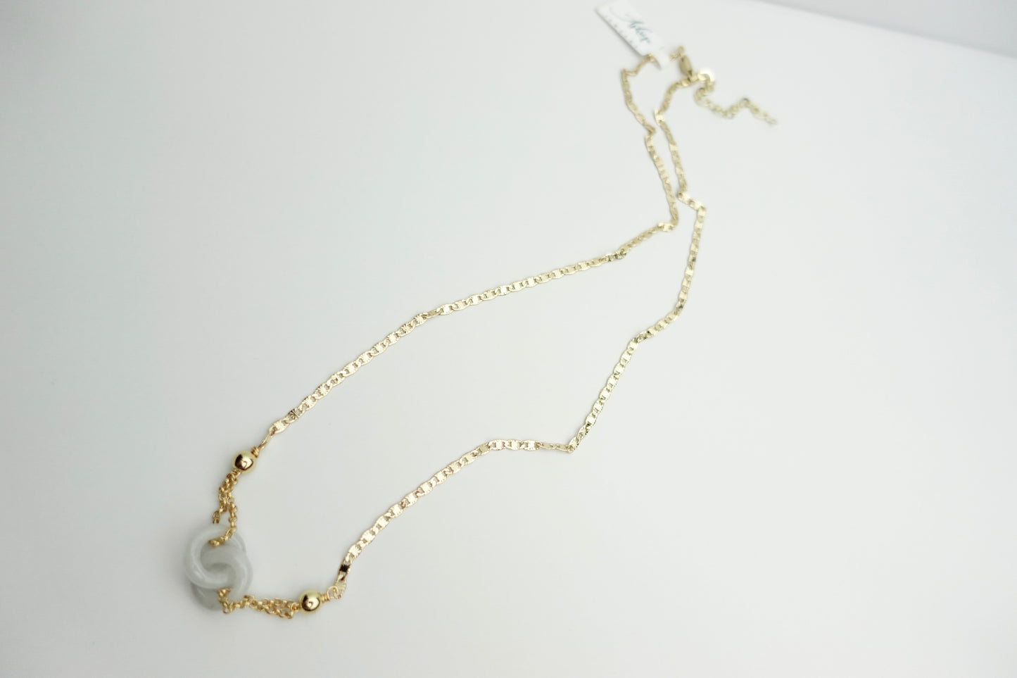Interlinked white jade necklace