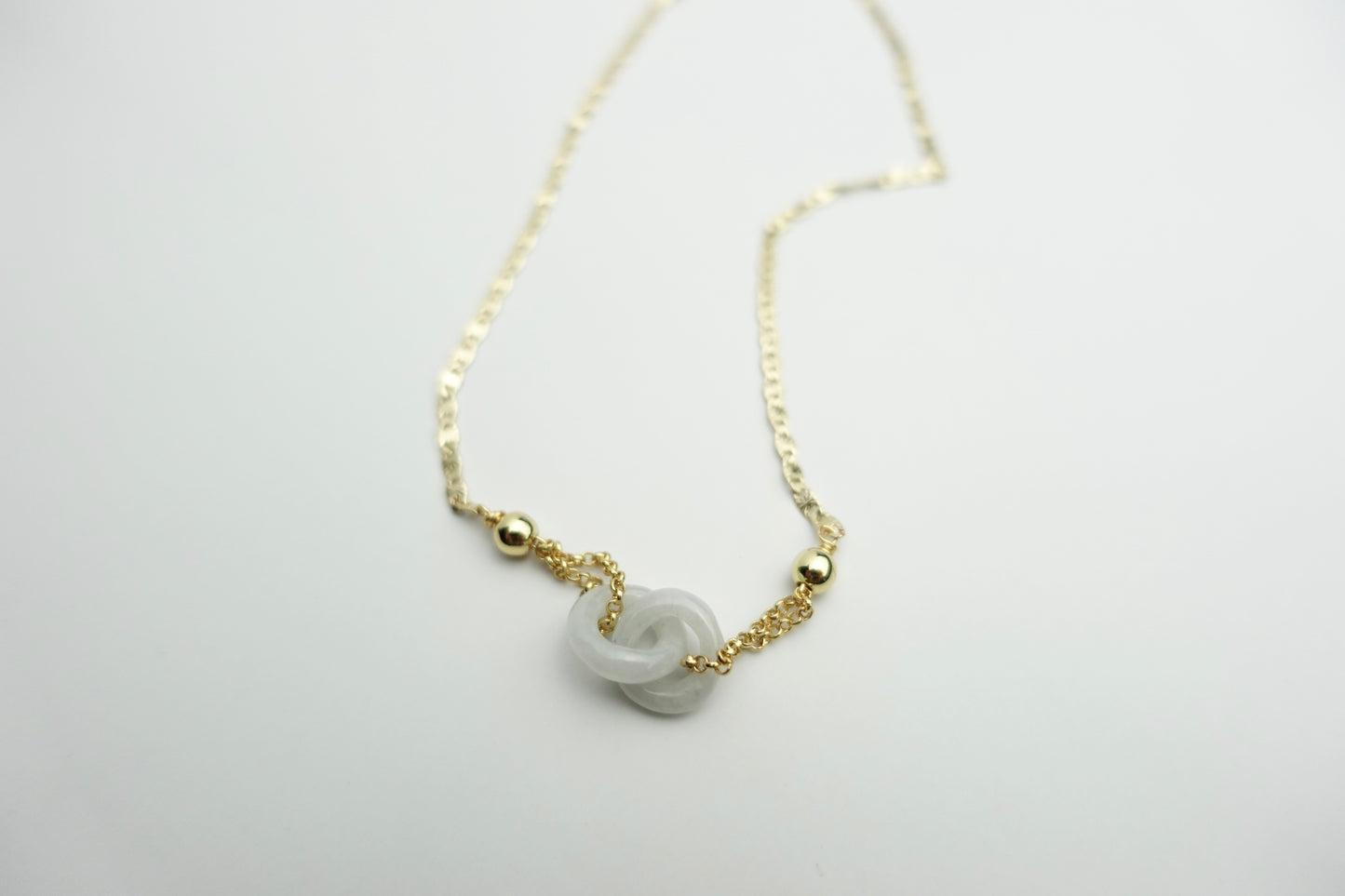Interlinked white jade necklace